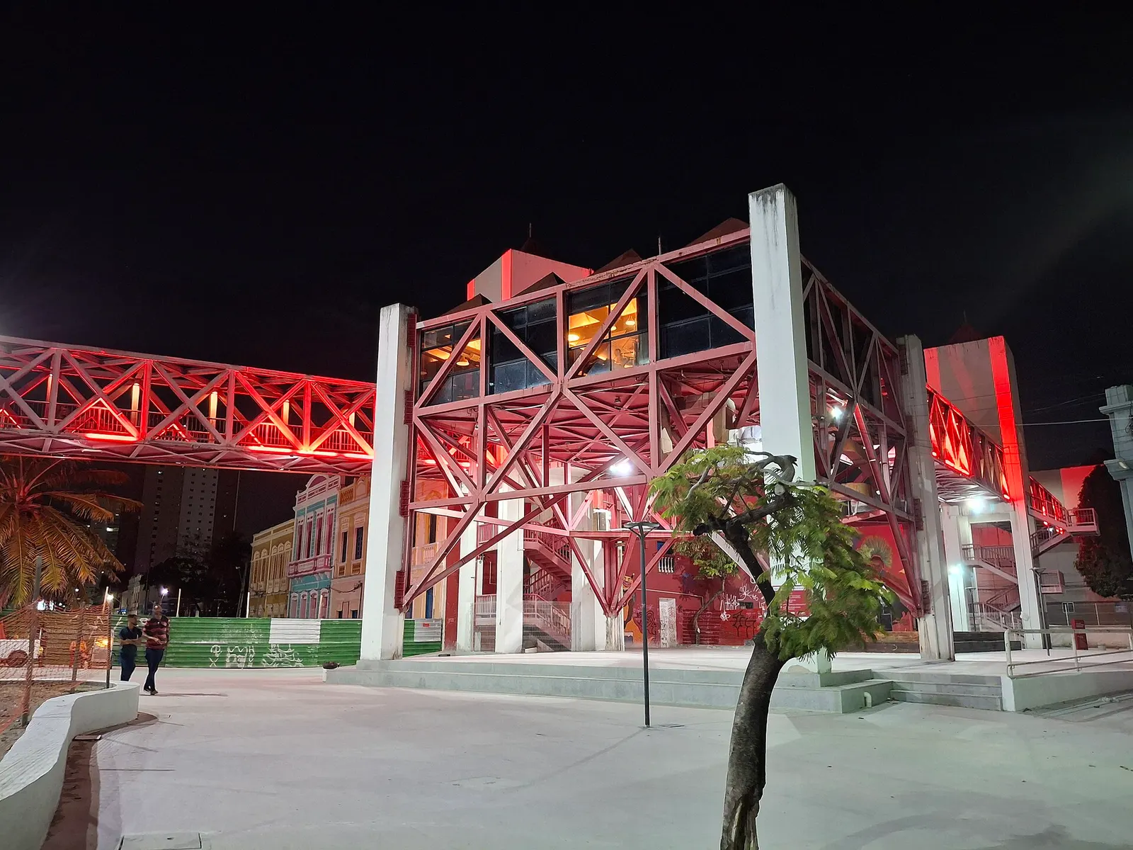 Centro Dragão do Mar at night, with the red footbridge between the buildings